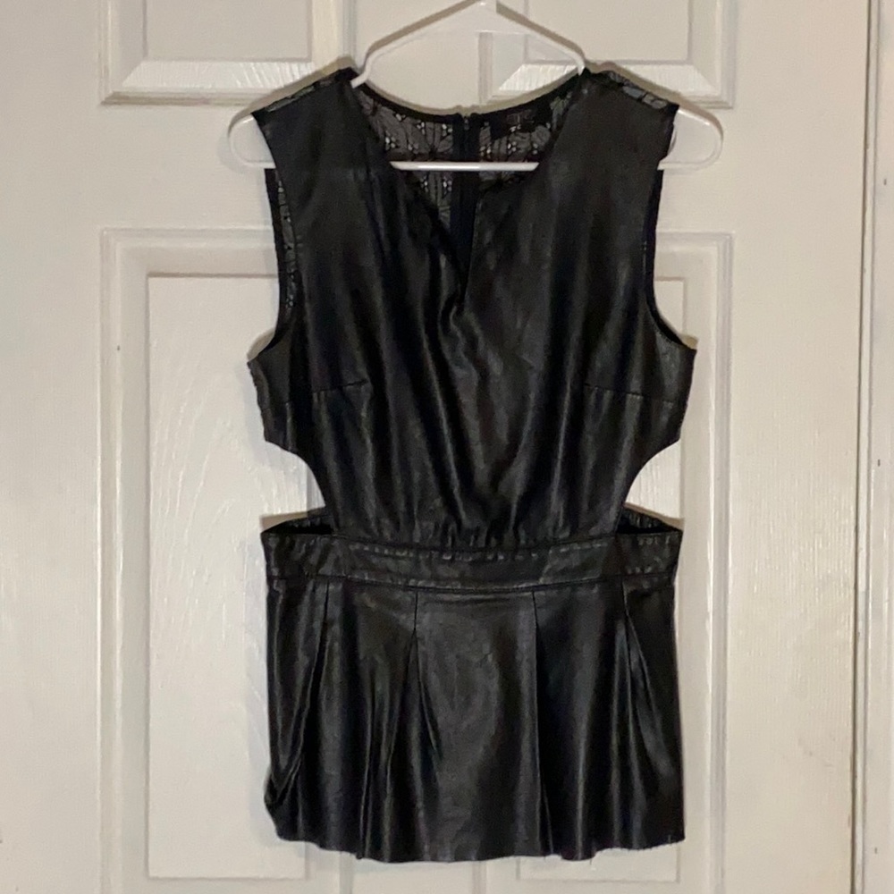 Black faux leather and lace cut out sides. Super cute and flattering